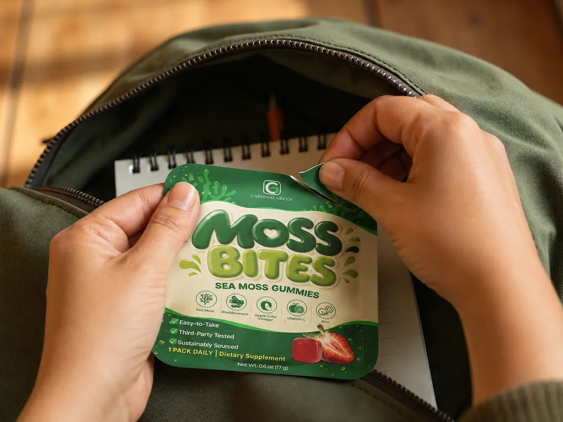 Hands lifting a Moss Bites daily pack out of a canvas backpack